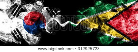 South Korea Vs Guyana, Guyanese Smoky Mystic Flags Placed Side By Side. Thick Colored Silky Abstract