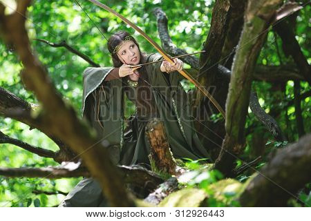 Elf Archer With A Bow In The Forest