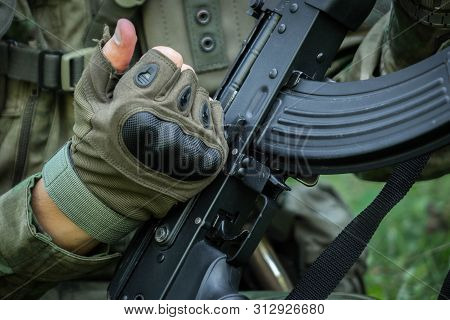 Receiver Box And Magazine Of Russian Assault Rifle Ak-74 With Backround Full Of Cartridges.