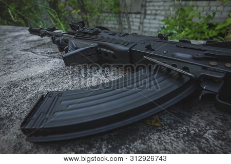Receiver Box And Magazine Of Russian Assault Rifle Ak-74 With Backround Full Of Cartridges.