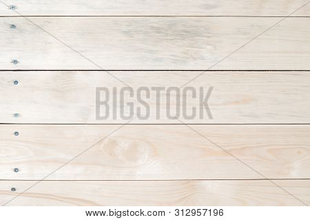 Light Wooden Background Made Of Natural Wood. The View From The Top. Natural Untreated Planed Textur