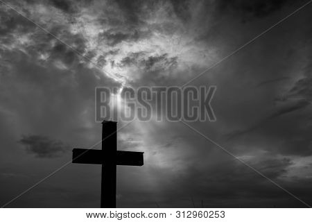 Silhouette Of A Simple Catholic Cross, Dramatic Stormclouds After Heavy Rain, Copy Space In Black An