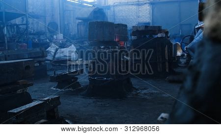 Cast Iron Mold. Stock Footage. Pressed Mold Fixed By Boards And Chains In Cubic Form For Heated Meta