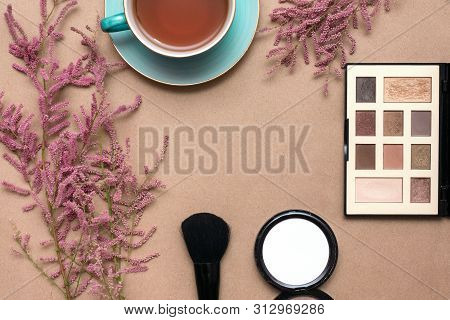 Make Up Concept Flat Lay Background. Make Up Brushes And Cosmetics, Cup Of Tea And A Blooming Tamari