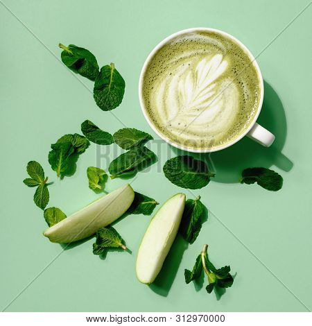Top View. Hot Tea Matcha Latte Milk Cup And Coffee Cup In Coffee Shop Cafe On Green Background. Crea