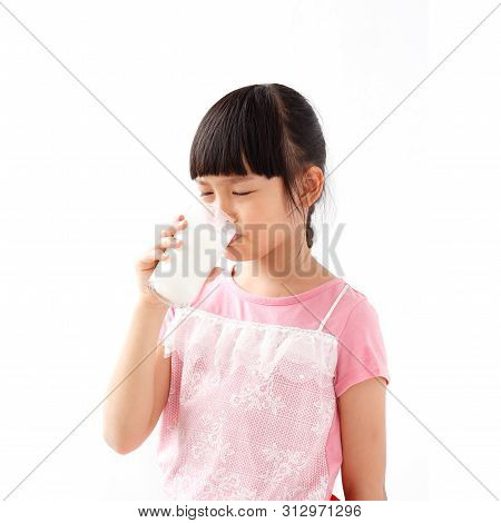 Asian Girl Unhappy To Drinking Milk. Isolated On White Background