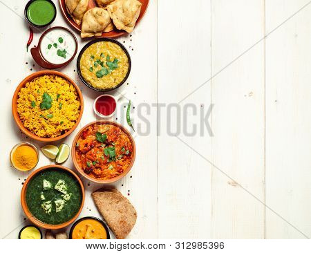 Indian Cuisine Dishes: Tikka Masala, Dal, Paneer, Samosa, Chapati, Chutney, Spices. Indian Food On W
