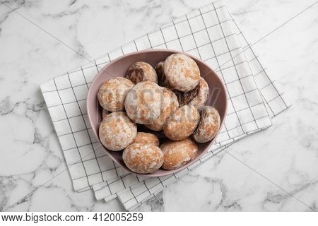 Tasty Homemade Gingerbread Cookies In Bowl On White Marble Table, Top View