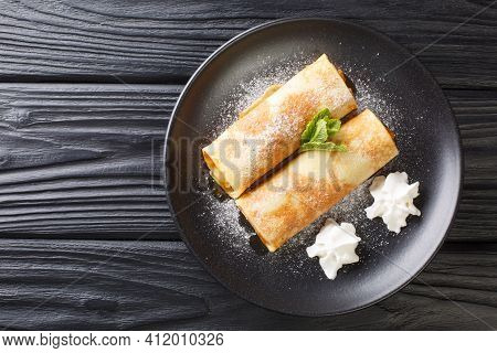 Apricot Crepes Traditional Austrian Cuisine Close-up In A Plate On The Table. Horizontal Top View Fr