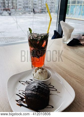 Dessert Fondan Chocolate With Ice-cream On A White Plate. Exquisite French Chocolate Dessert Top Vie