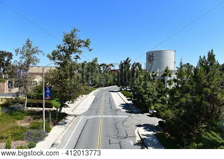 IRVINE, CALIFORNIA - 22 APRIL 2020: Peltason Drive towards the Water Tower, seen from Student Center Bridge, on the UC Irvine Campus. 