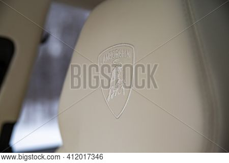 Moscow, Russia - December 15, 2020: Coat Of Arms Lamborghini Logo On The Headrest In Light Leather I