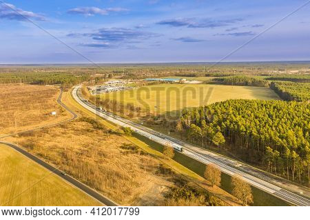 High Altitude View, Photo Taken With A Drone. Flat, Vast Terrain, Fields, Meadows And A Pine Forest.