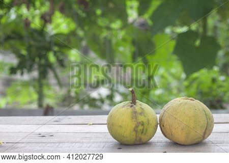 Ripe Santol Or Sentul Fruit (sandoricum Koetjape) On Wooden Table With Blur Nature Background.
