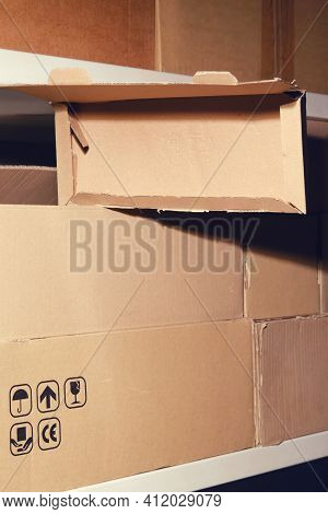 Theft In A Warehouse During A Lockdown. Empty Warehouse With Opened Boxes