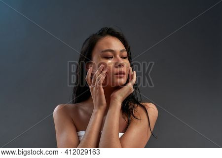 Young Sensual Beautiful Asian Woman Touching Eye Patches With Fingers Of Two Hands And Pressing Them