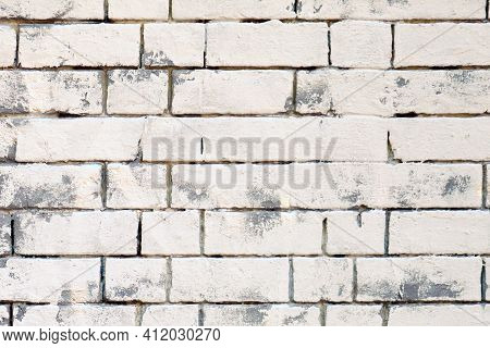 The Texture Of The Walls Are Of White Brickwork With Gray Seats. White And Gray Bricks Are Painted B