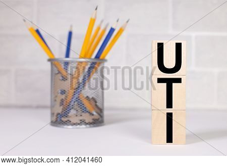 Uti. Text On Wood Cubes. Text In Black Letters On Wood Blocks