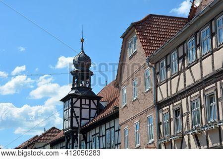 Bell Tower From The Town Hall In Ostheim Vor Der Rhoen, Bavaria, Germany With House Facades