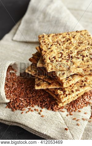 Multigrain Crispbread With Flax Seeds On Linen Napkin.