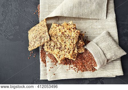 Multigrain Crispbread With Flax Seeds In A Burlap Bag.