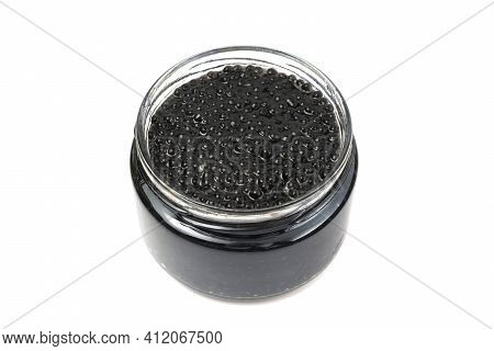 Black Caviar In A Glass Jar. Isolated On White Background. Copy Space.