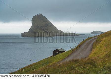 Bour Village Grass-covered Picturesque Houses At The Faroese Coastline In The Village Bour With View