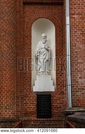 Statue Of The Saint Paul On The External Wall Of The Church Of The Ascension Of Christ In Utena, Lit