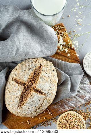 Homemade Loaf Of Freshly Baked Green Buckwheat Bread And Organic Buckwheat Milk. Wooden, Linen Napki