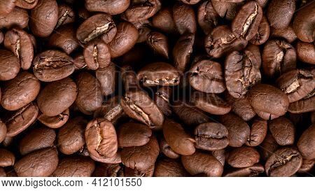 Roasted Coffee Beans Texture background. close-up.