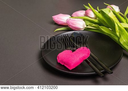 Festive Creative Black Table Setting With Tulips On Dark Background