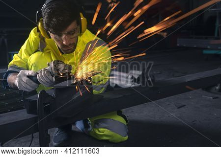 Electric Wheel Grinding On Steel Structure In Factory, This Image Can Use For Industrial, Worker And