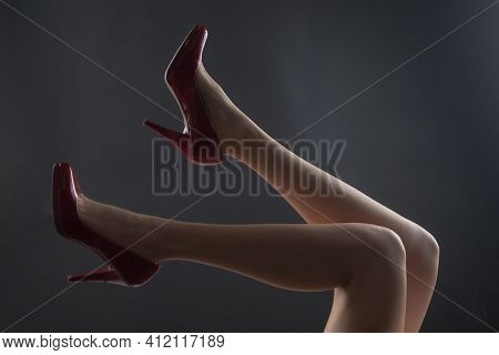 Legs In Red Heels. Fashion Shoes Style. Girl Sexy Slim Feet