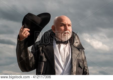 Handsome Fashion Senior Old Mature Man. Elderly Mature Greybeard. Close Up Face Portrait Of Senior. 