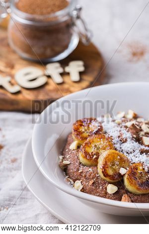 Teff Grain Porridge With Banana Topping For Breakfast