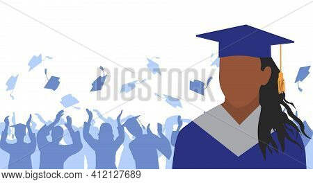 African American Girl Graduate In Mantle And Academic Square Cap On Background Of Cheerful Crowd Of 