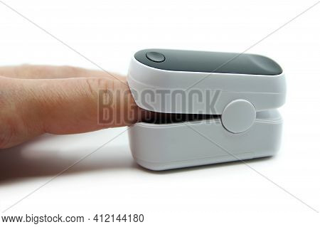 Pulse Oximeter Isolated On White Background. Pulse Oximeter Used To Measure Pulse Rate And Oxygen Le