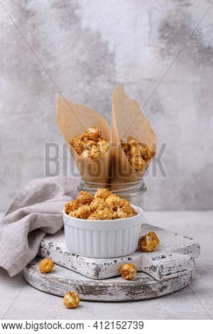 Salted Caramel Popcorn In Bowl On Light Background
