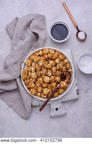 Salted Caramel Popcorn In Bowl On Light Background