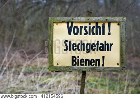 Sign At The Edge Of The Forest In Germany With The Inscription Caution Danger Of Stinging Bees