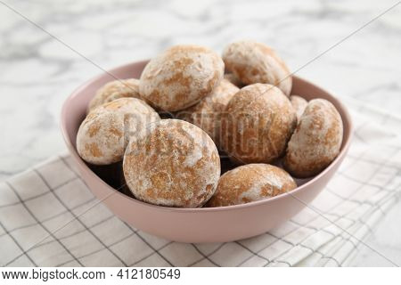 Tasty Homemade Gingerbread Cookies In Bowl On White Marble Table, Closeup
