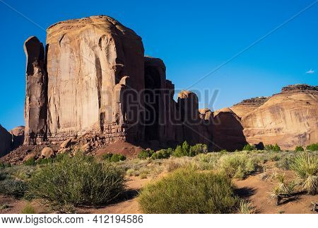 Cliff Face Of Spearhead Mesa Rock Formation In Monument Valley Tribal Park In Arizona, United States