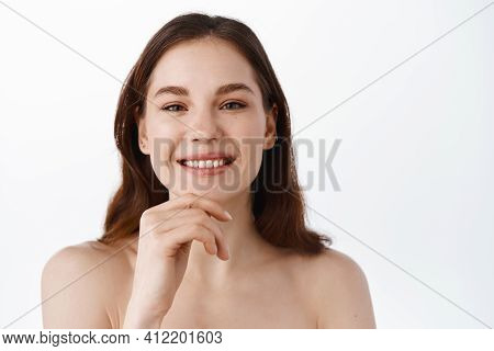 Beauty Face. Young Happy Woman With Hydrated Skin Using Collagen Anti-aging Treatment, Smiling Pleas