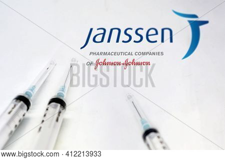New York Usa, February 10th 2021: Three Syringe Next To The Janssen Logo Isolated On A White Backgro