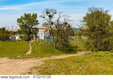 Wroclaw, Poland - May 8 2020: Footpaths On Hill Between Trees And Bushes