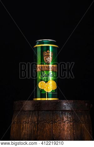Can Of Perlenbacher Radler Beer On Beer Barrel With Dark Background. Illustrative Editorial Photo Sh