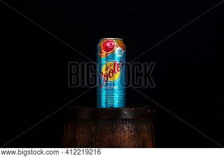 Can Of Ursus Cooler Beer On Beer Barrel With Dark Background. Illustrative Editorial Photo Shot In B