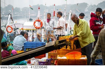 Unidentified Women And Men Trade In A Wide Variety Of Fish At One Of The Oldest Fish Market In Mumba