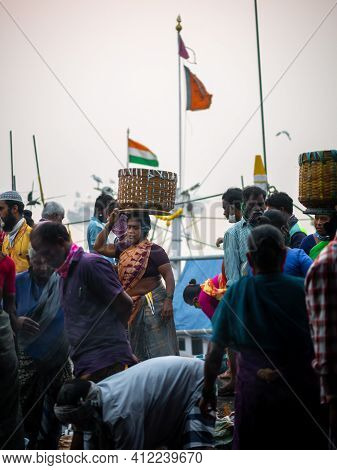 Unidentified Women And Men Trade In A Wide Variety Of Fish At One Of The Oldest Fish Market In Mumba