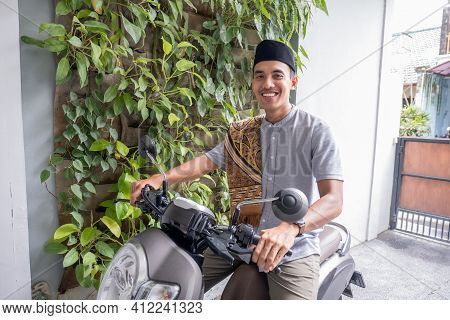 Muslim Male Going To The Mosque By Riding Motorbike